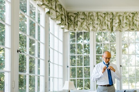 groom getting ready at The King's Daughters Inn