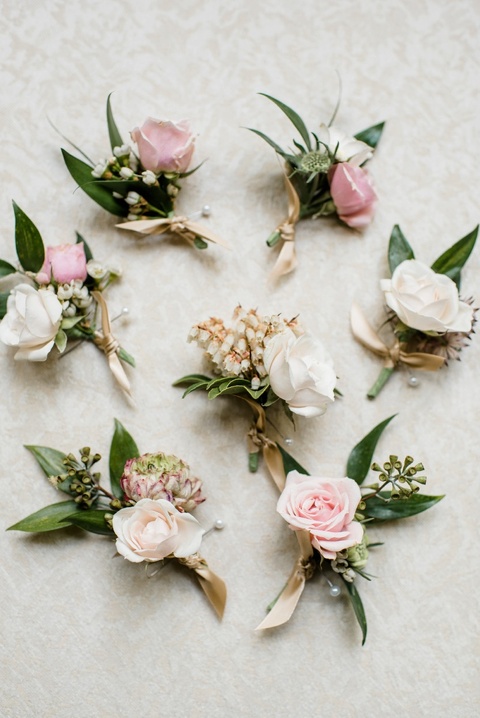 Blush and white boutonnieres. Coordination by Kast Events at the Chapel Hill Carriage House. Photo by Caroline Lima.