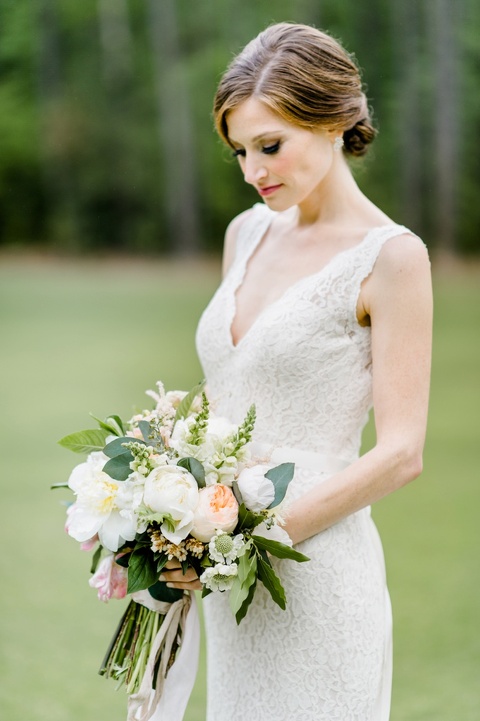 Blush and yellow peony bouquet. Mikaela wedding gown. Coordination by Kast Events at the Chapel Hill Carriage House. Photo by Caroline Lima.