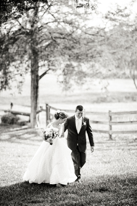 Outdoor farm wedding in Richmond VA coordinated by Make It Posh Events. Flowers by Petals and Twigs. Hayley Paige striped dress. Photo by Caroline Lima.