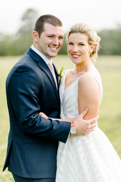 Outdoor farm wedding in Richmond VA coordinated by Make It Posh Events. Flowers by Petals and Twigs. Hayley Paige striped dress. Photo by Caroline Lima.