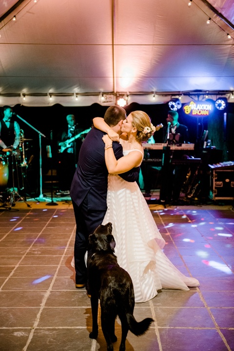 Bride and groom first dance. Rustic wedding coordinated by Make It Posh Events. Hayley Paige striped dress. Photo by Caroline Lima.