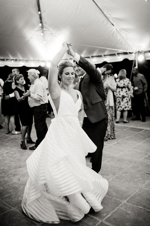 Rustic farm wedding in Richmond VA coordinated by Make It Posh Events. Hayley Paige striped dress. Photo by Caroline Lima.