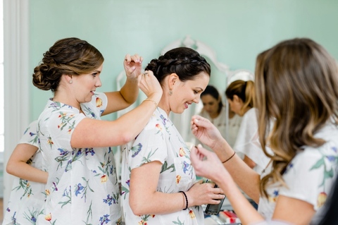 Bridesmaids wearing matching pajamas at Merrimon-Wynne House